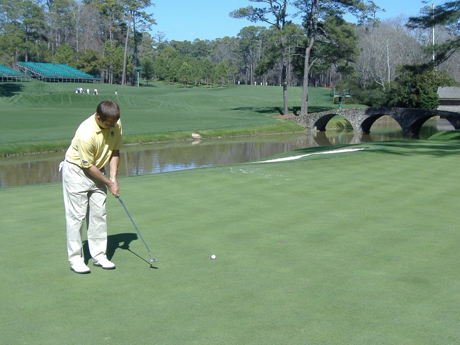The 12th green and the Hogan Bridge over Rae's Creek.