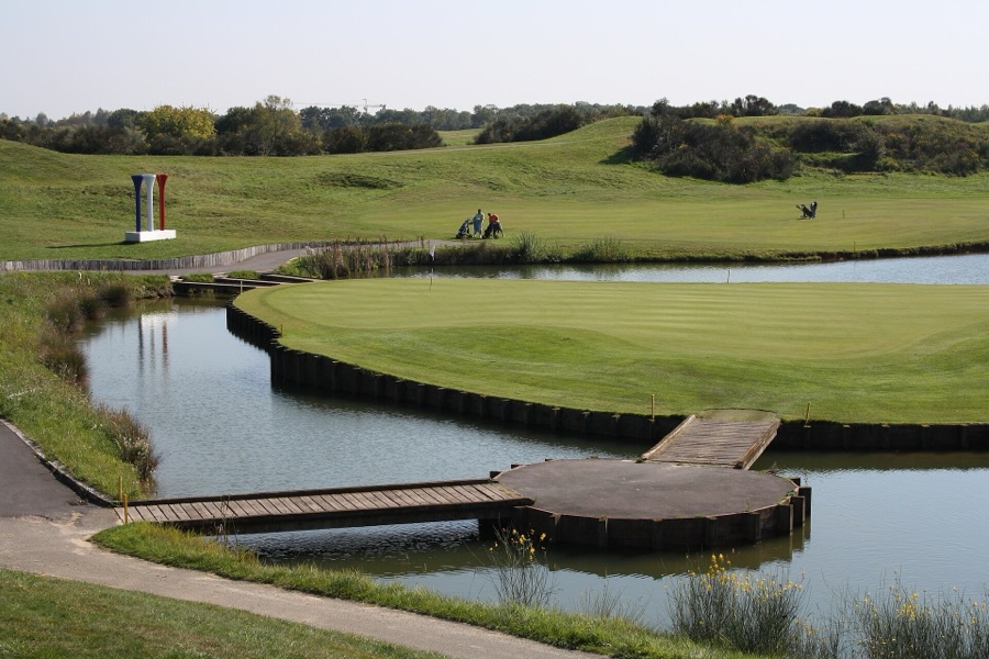 A green with the bulkhead along the water.
