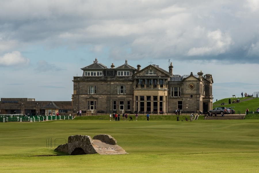 The Swilcan Bridge and the clubhouse behind the 18th green.