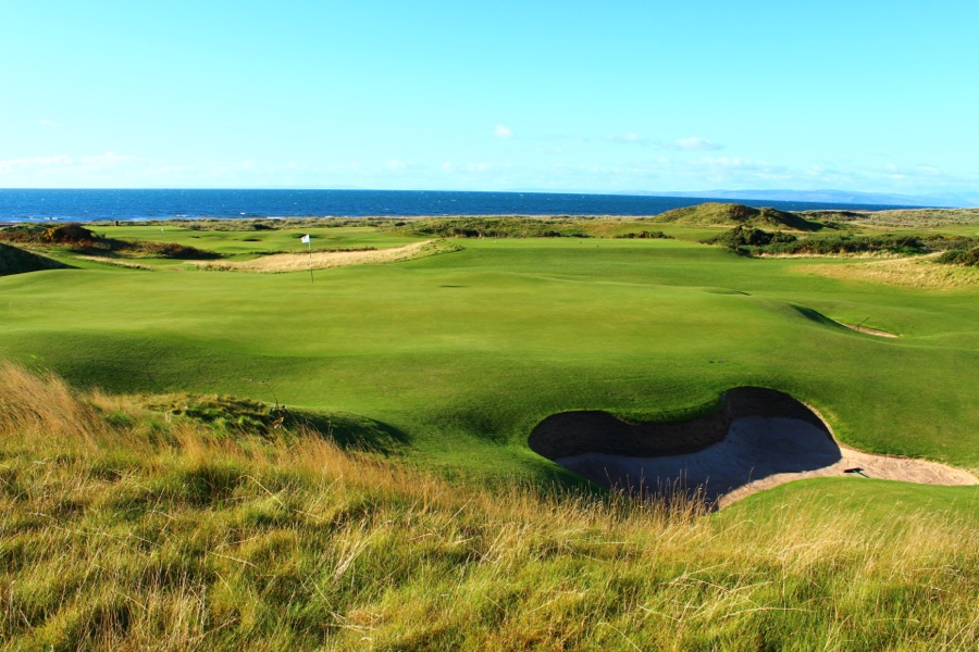 A green and its bunkers above the firth.