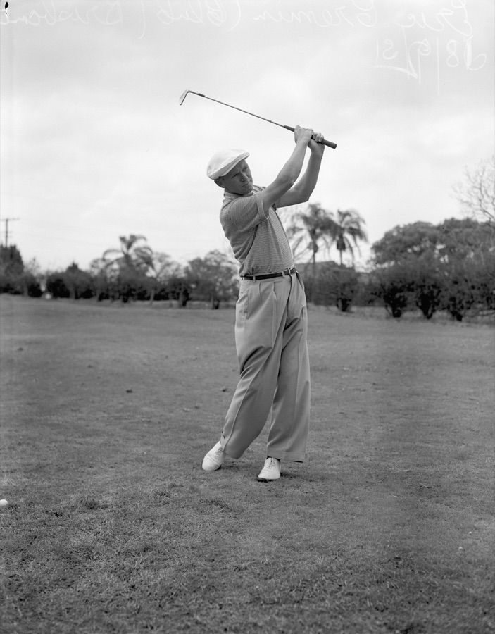 A black and white photograph of the Australian professional Eric Cremin swinging during a tournament in Brisbane.