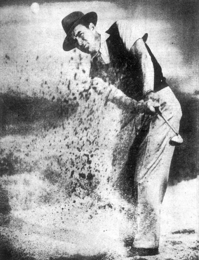 A black and white photograph from 1950 of Sam Snead playing out of a sand trap, hands and wrists clear in the frame.